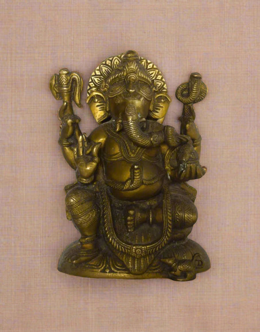 Invite peace, positivity, and divine protection into your space with Shanti Vinayaka, a beautifully handcrafted brass statue of Lord Ganesha in a blessing posture. 