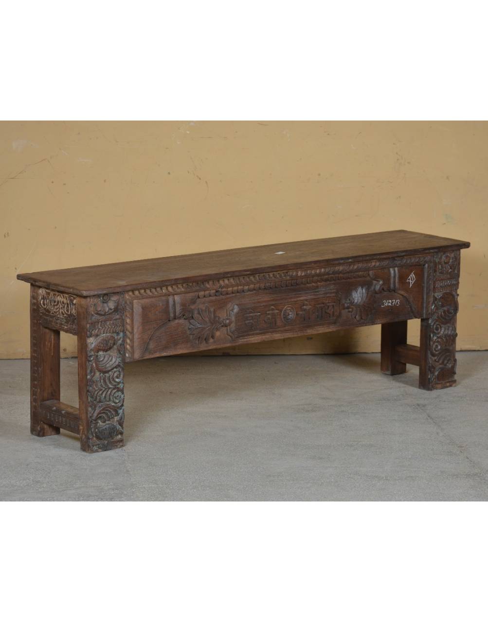 The Shilpa Carved Teak Bench is a timeless celebration of India's rich woodworking tradition, meticulously crafted from solid teak wood.