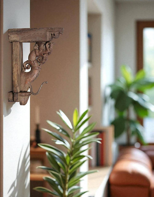 Bring home a piece of heritage with the Simha Bracket, intricately carved from reclaimed wood.