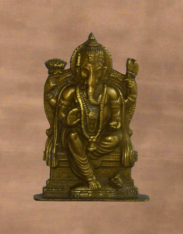 Add a divine touch of royalty and wisdom to your home or office with Singhasan Murti, a beautifully handcrafted brass Lord Ganesha statue seated majestically on a throne. 