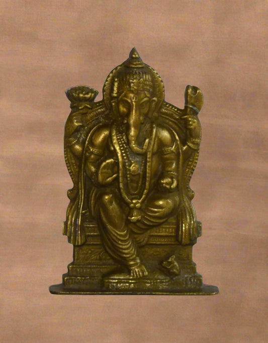 Add a divine touch of royalty and wisdom to your home or office with Singhasan Murti, a beautifully handcrafted brass Lord Ganesha statue seated majestically on a throne. 