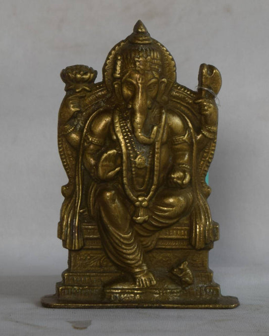 Symbolizing power, stability, and protection, this idol captures Ganpati Bappa in his regal form, complete with traditional ornaments, a serene expression, and his loyal vahana – the Mushak (mouse).