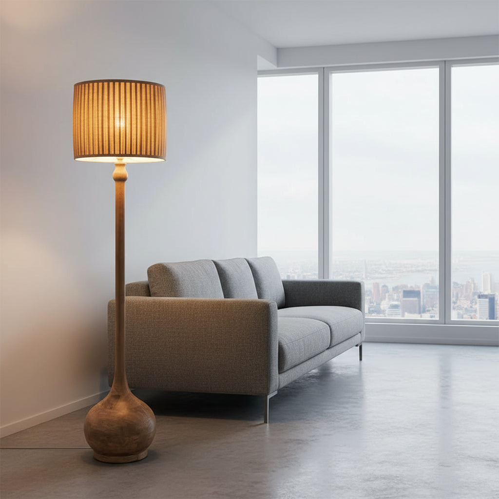 Floor lamp with a textured shade next to a chair in a room with a window and curtains.
