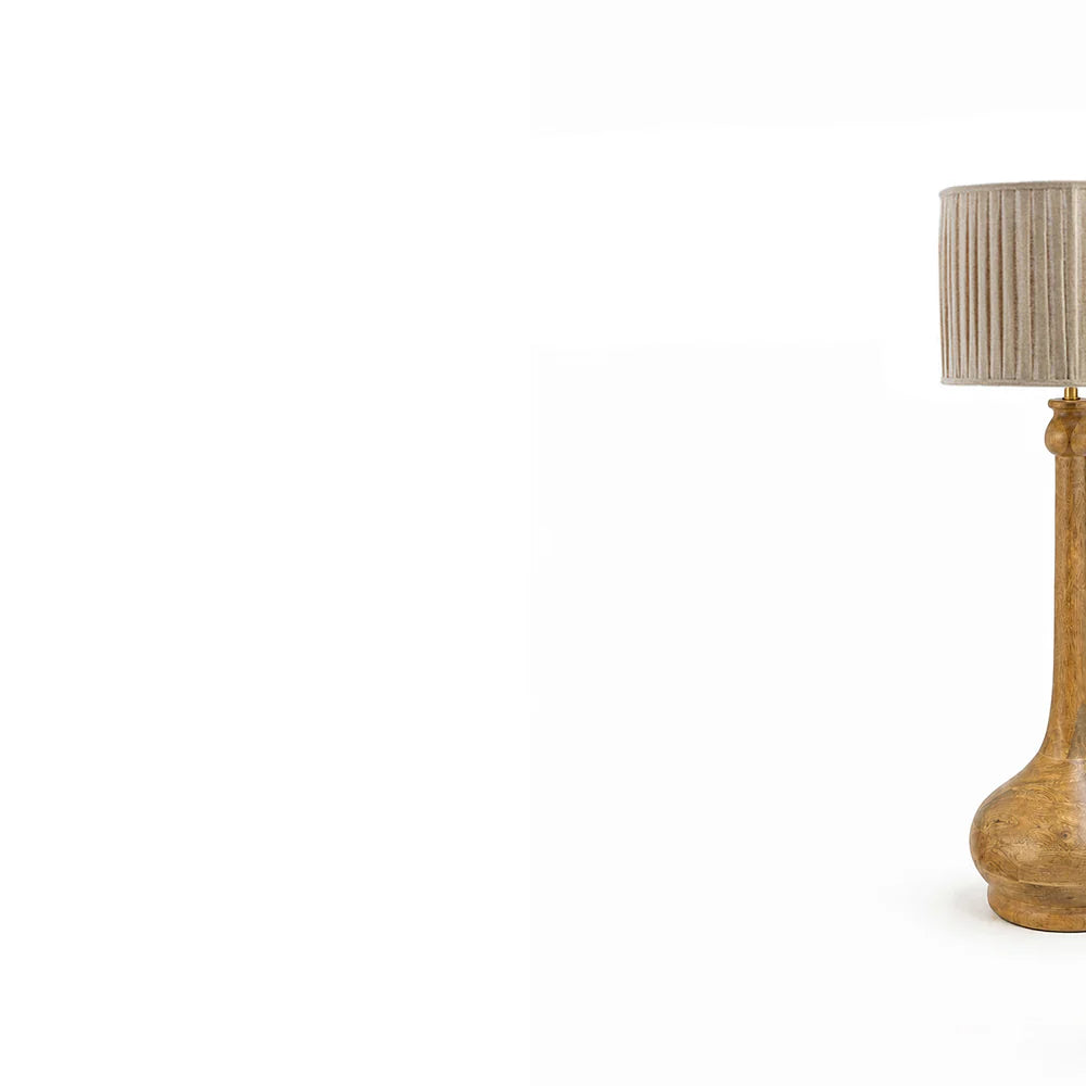 Table lamp with a wooden base and striped shade on a white background