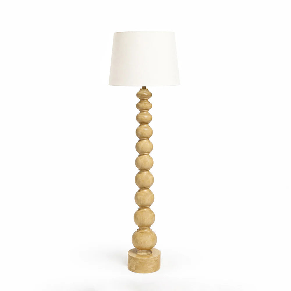 Wooden floor lamp with a white shade on a white background