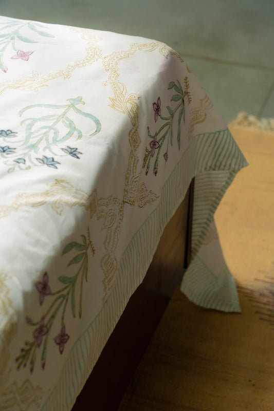 Floral patterned tablecloth on a wooden table