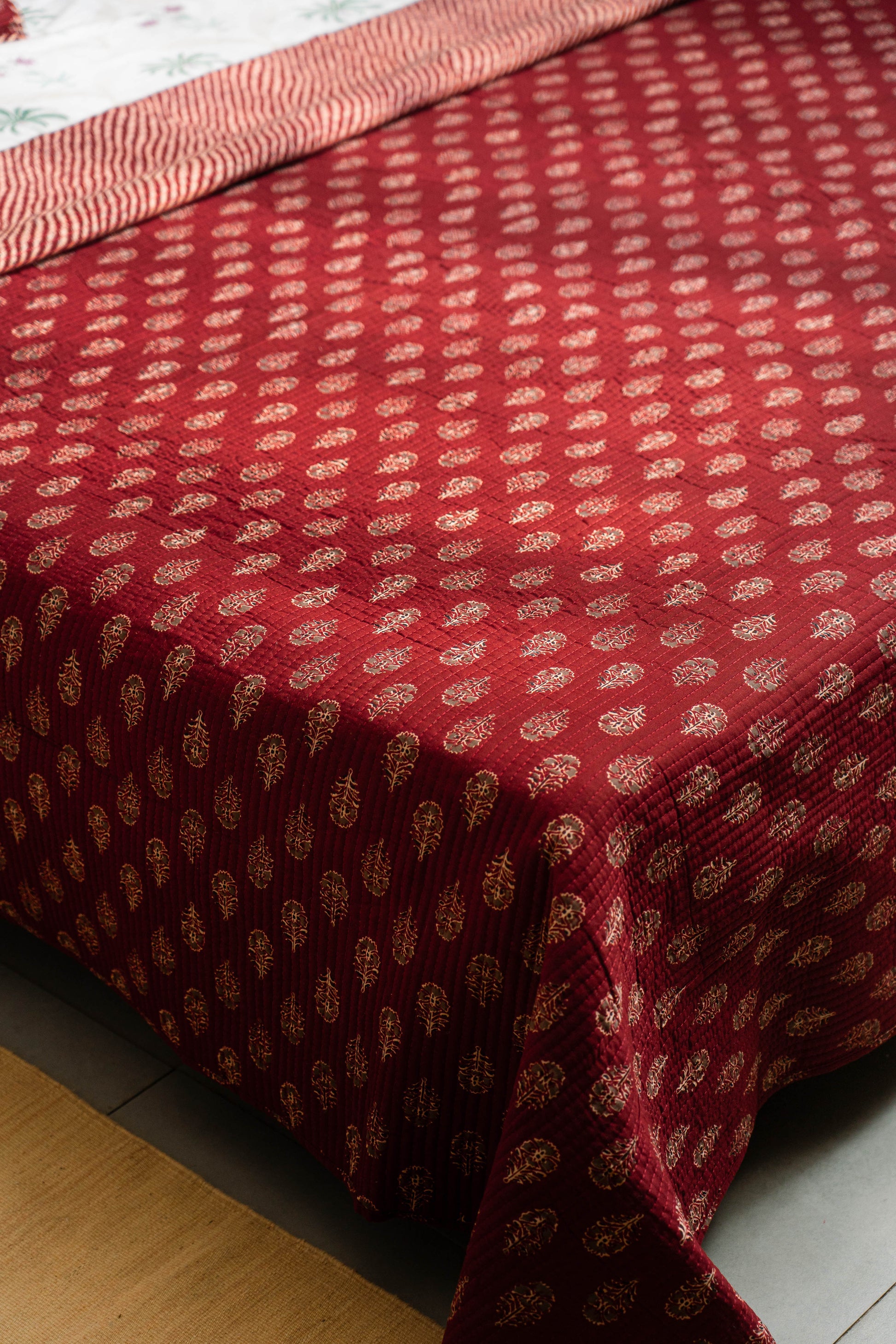 Red fabric with a subtle pattern on a wooden surface