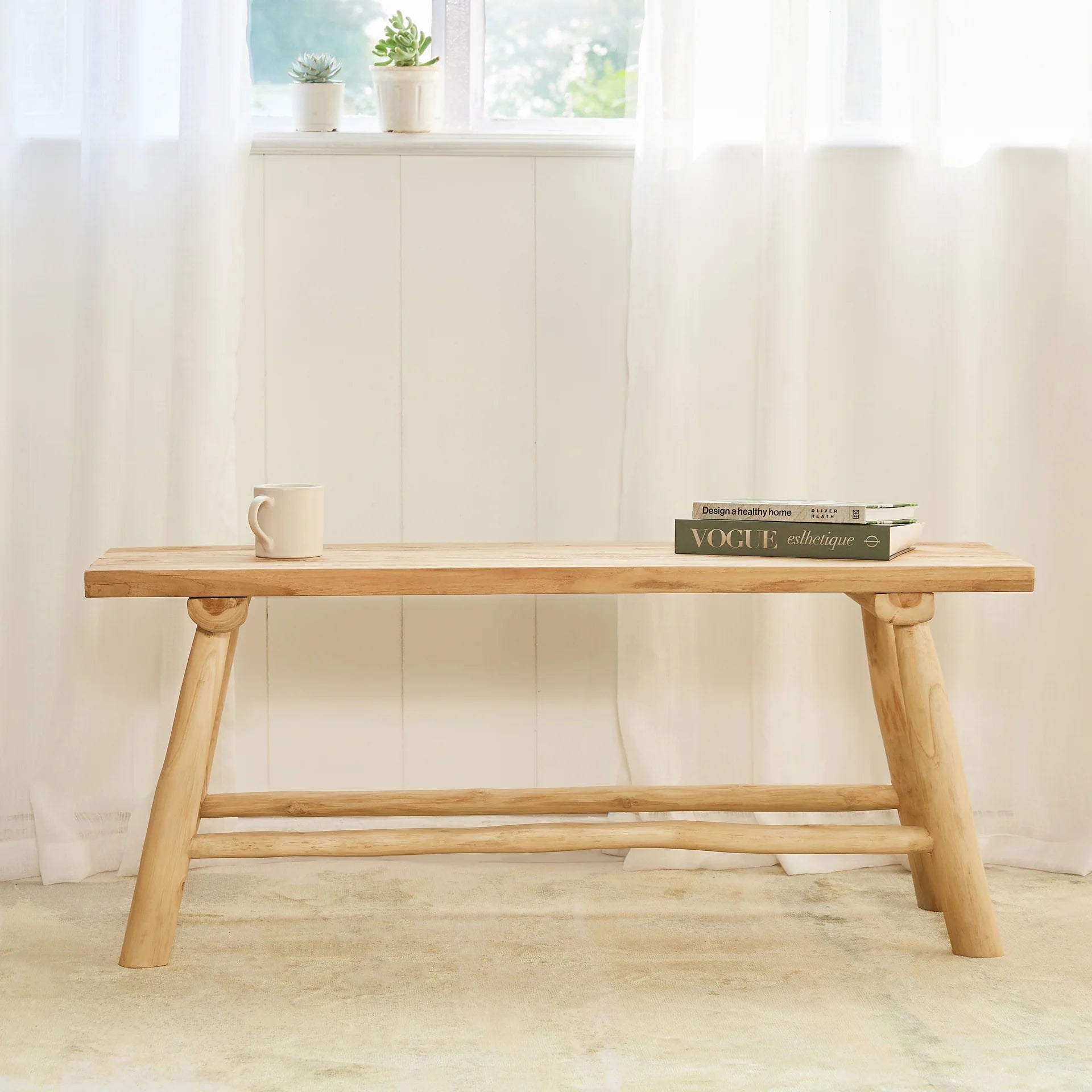 The Timber Grace Bench is an elegant, versatile piece of furniture designed to bring both style and function to a variety of spaces.