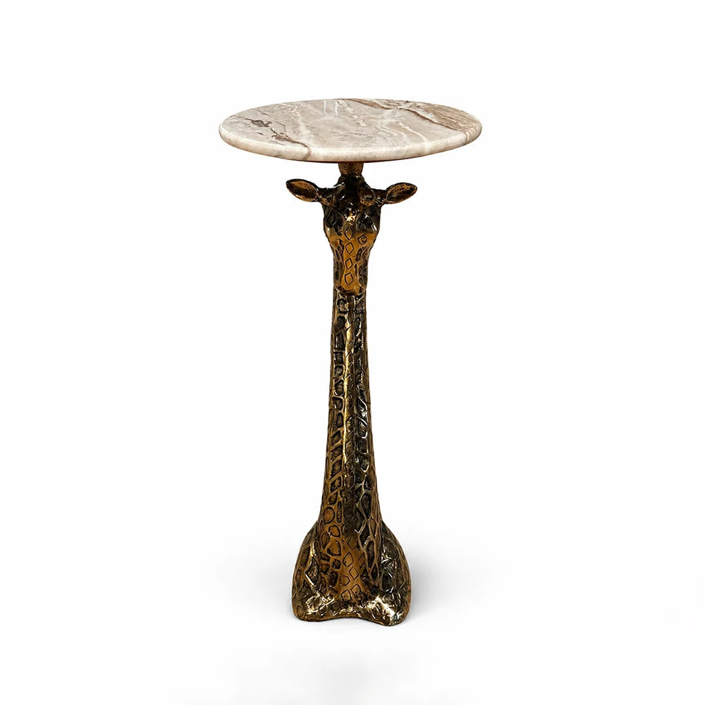 A giraffe-head side table with a round beige marble top and a textured metallic gold and dark bronze neck base, shown on a white background.