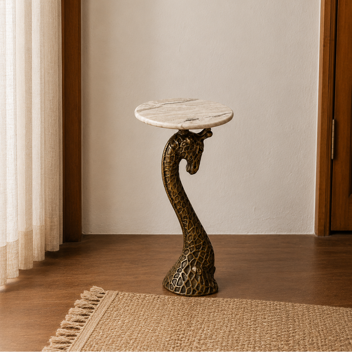 A decorative side table with a round white marble top and a sculpted bronze giraffe-head pedestal base, placed on a woven rug in a warm indoor setting.