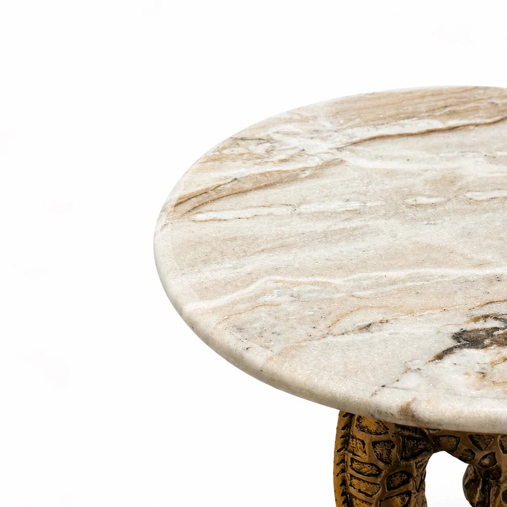 Round marble table with a white and beige marbled surface on a white background