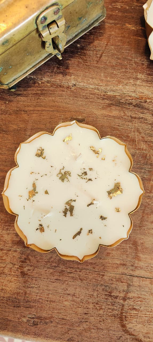 Decorative dish with gold trim on a wooden surface