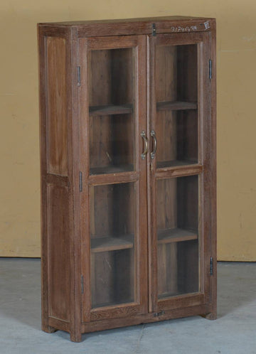 Elevate your home décor with this beautifully Teak Wood Glass Display Cabinet. Featuring glass-paneled doors for an elegant touch, this cabinet provides ample shelving to showcase your treasured collectibles, books, or decorative pieces. 