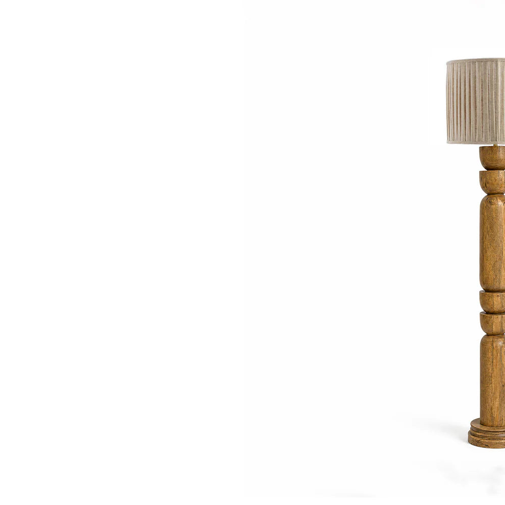 Wooden lamp base with a pleated beige lampshade on a white background