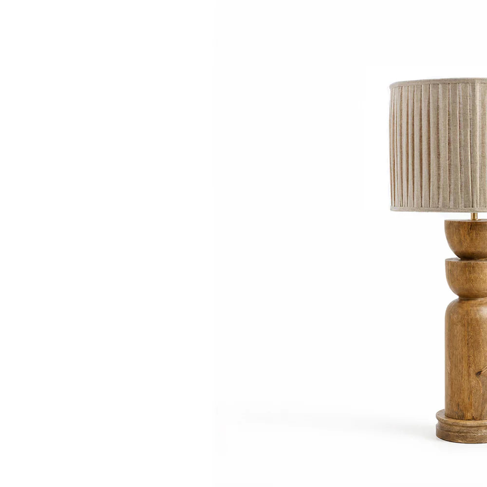 Wooden table lamp with a beige lampshade on a white background
