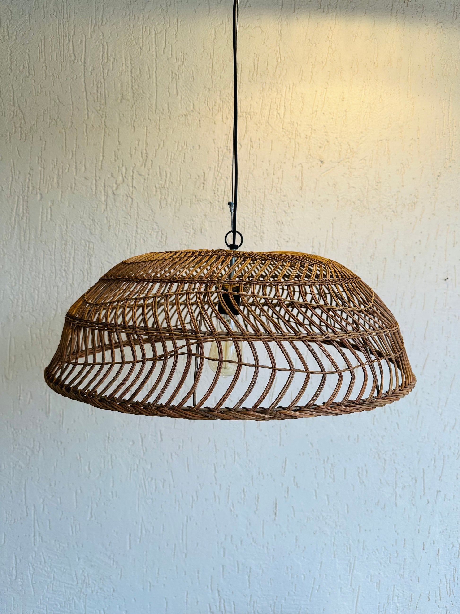 Handcrafted rattan pendant light adds bohemian charm to any space. Versatile design suits bedrooms, living areas, or covered patios. Expertly crafted for quality, adaptable to various ceiling heights. Each piece intricately woven by artisans, perfect for coastal, boho, or rustic decor. tesu