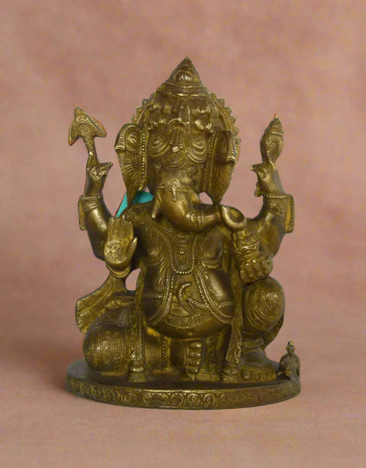 Invite divine blessings into your home with The Blessing Ganesha, a beautifully handcrafted brass statue of Lord Ganesha in a seated, blessing posture. 