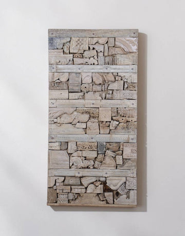 Unique mosaic design made from salvaged carved wood fragments.