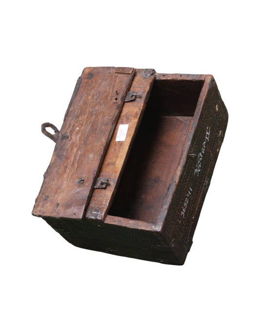 A vintage wooden storage chest with an open lid, showing weathered wood grain, metal hinges, and handwritten markings on the side, isolated on a white background.