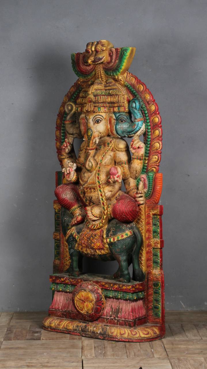 This intricately detailed masterpiece showcases Lord Ganesha in a traditional pose, adorned with rich embellishments and vibrant colors that reflect cultural heritage..