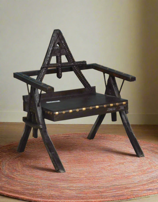 Add a bold statement piece to your space with the Triangle Back Wooden Chair, a handcrafted design that blends rustic charm with traditional craftsmanship. 