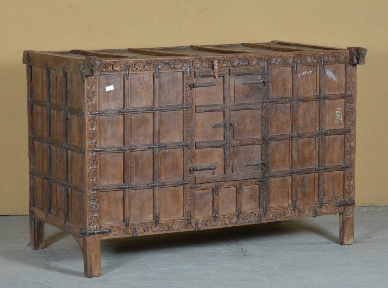  The age-worn patina and iron latchwork enhance its rustic charm, making it a piece that carries stories from the past into modern spaces. 