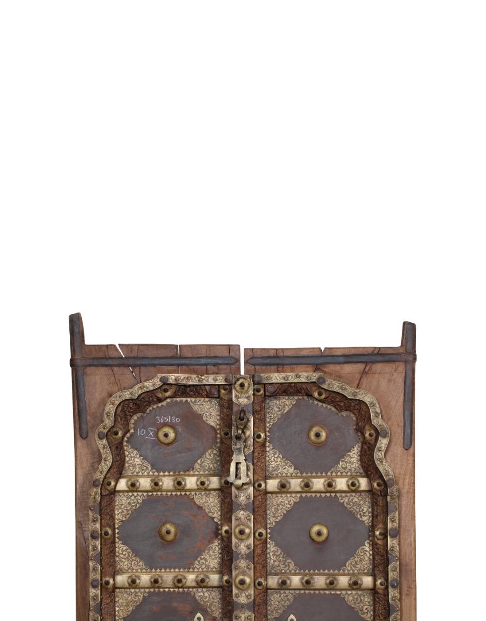An antique wooden door with ornate metal studs, rivets, and decorative panels, shown against a solid white background.