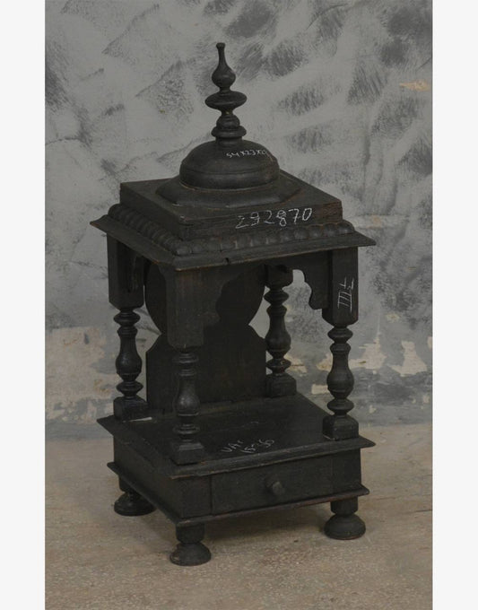 Thoughtfully handcrafted from premium teak wood, this temple stands tall in a majestic black finish, symbolizing depth, devotion, and timeless grace.