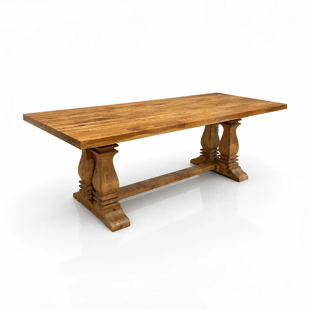 A rustic wooden dining table with a rectangular slab top and turned trestle-style legs, shown on a clean white background.