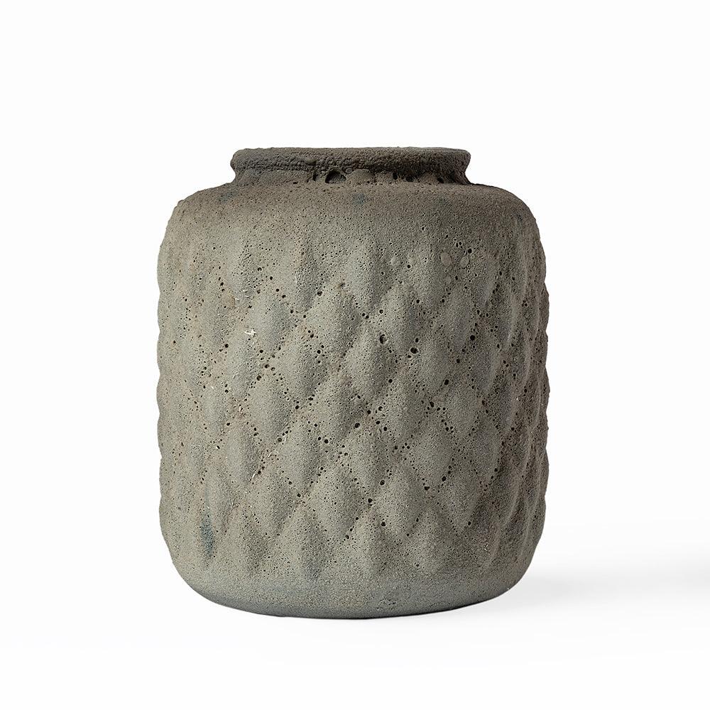 Crafted from durable ceramic, its soft matte finish and raised diamond texture echo the quiet beauty of natural stone and forest forms.