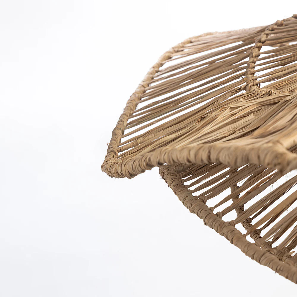 Close-up of a woven rattan chair on a white background