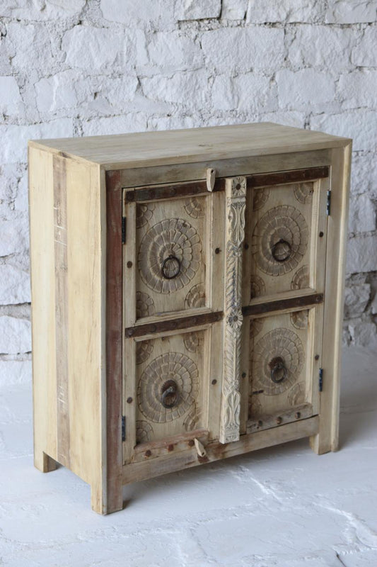  Featuring exquisitely carved lotus motifs, rustic iron ring handles, and a distressed natural finish, 