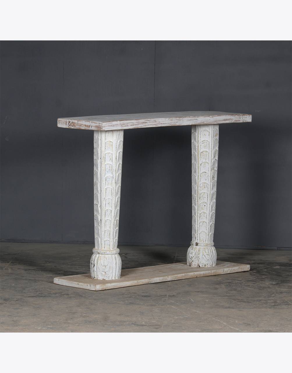 Side view of white carved console table showing column-style legs and classic carved frame – Tesu Furniture & Seating