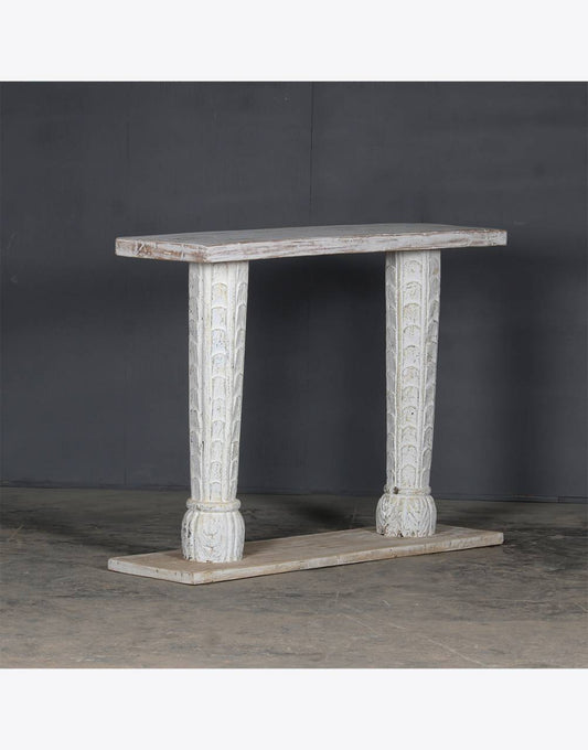 Side view of white carved console table showing column-style legs and classic carved frame – Tesu Furniture & Seating