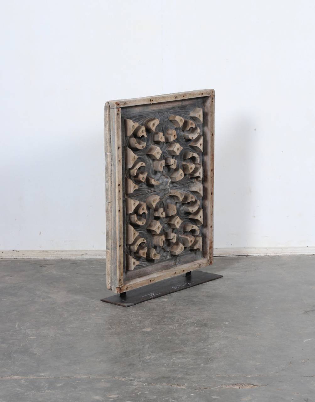 Crafted from recycled wood and finished in a natural color,