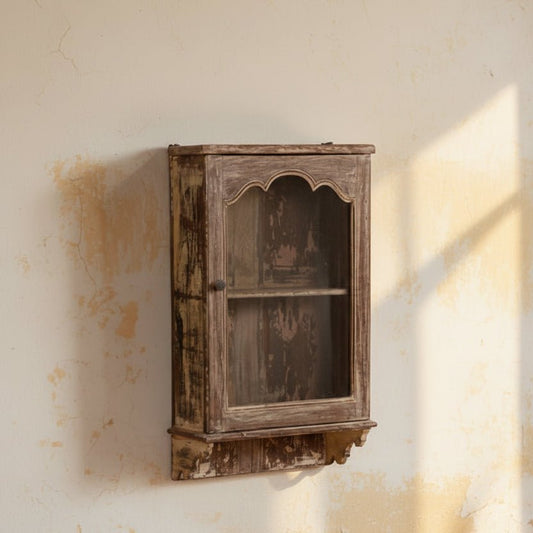 Rustic wooden shelf with arched design on a white wall