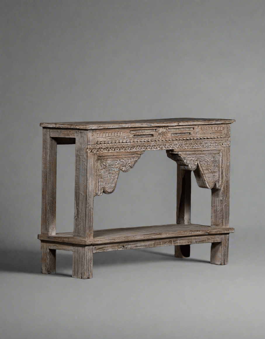 Wooden console table with intricate carvings on a gray background