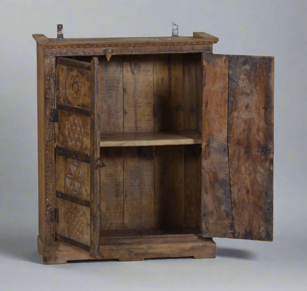 Wooden cabinet with open doors on a gray background