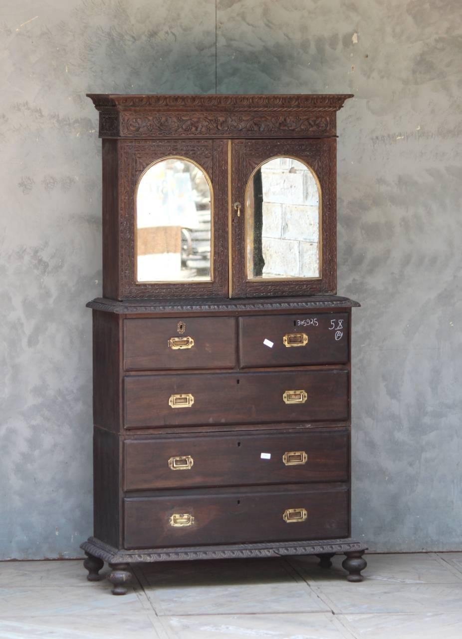 Antique wooden almirah with mirrored top section against textured wall – Tesu Furniture & Seating