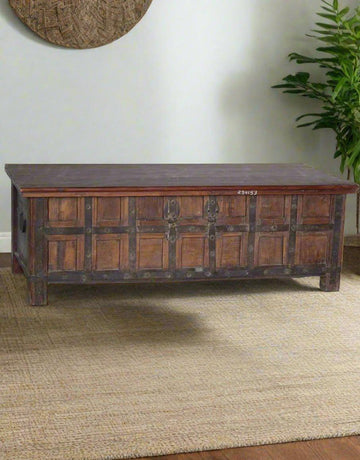Antique wooden coffee table with iron accents in natural brown teak wood, 58 inches wide storage chest