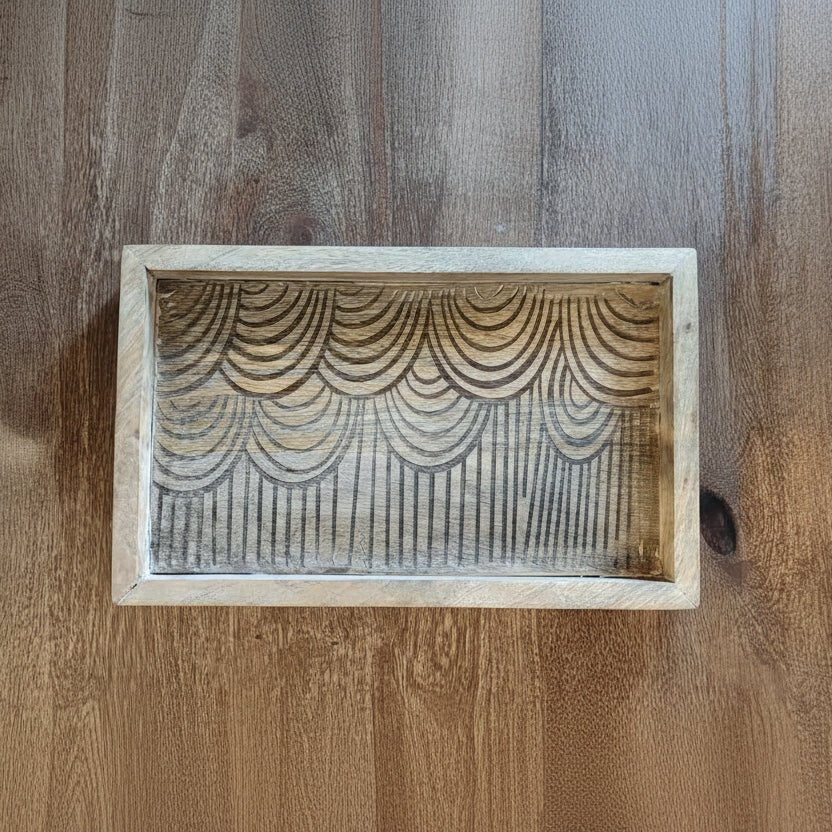 Wooden box with decorative pattern on a wooden surface