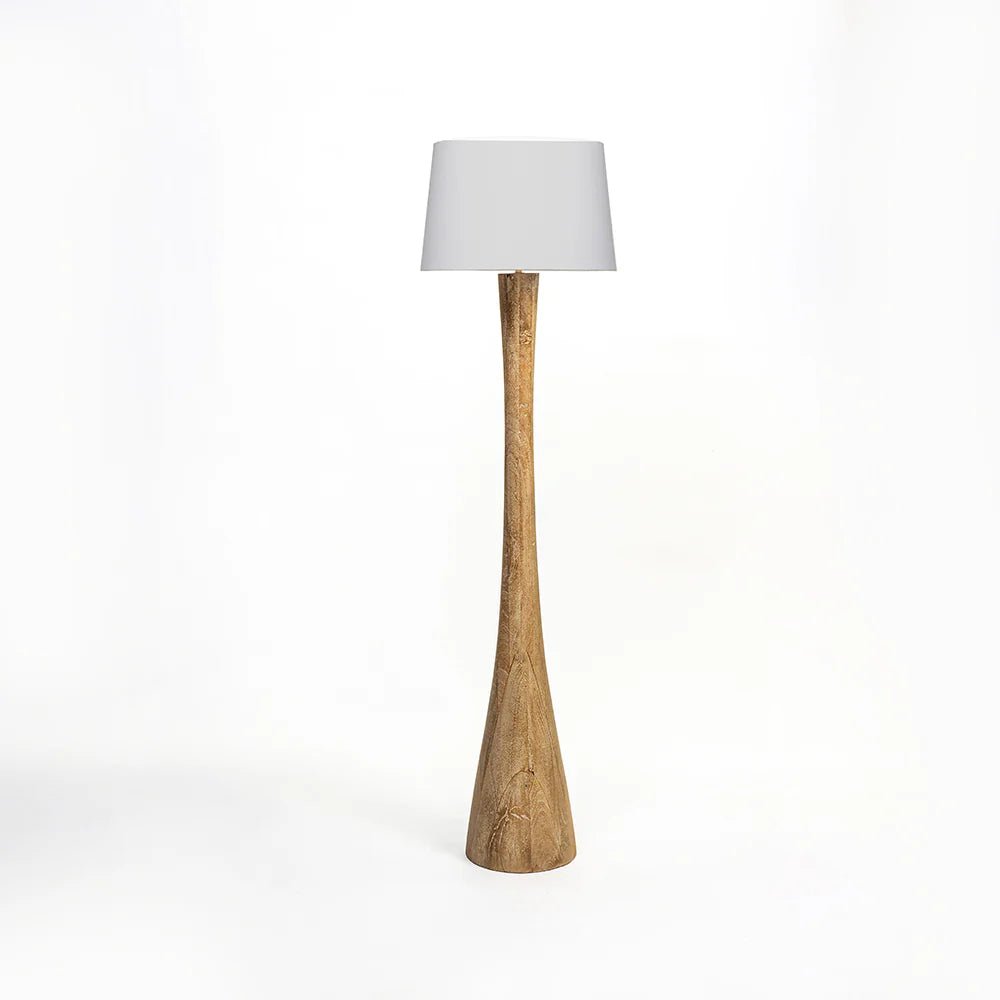 Floor lamp with wooden base and white shade on a white background