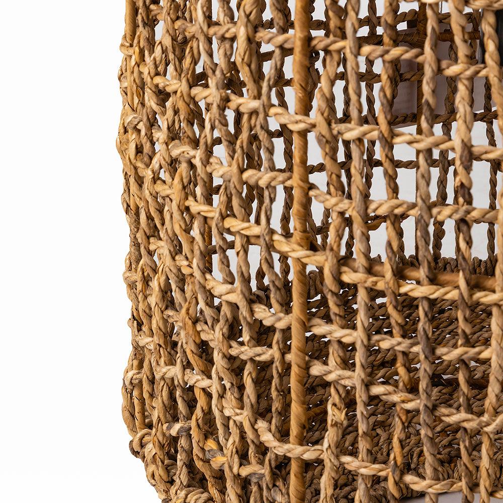 Close-up of a woven rattan basket on a white background