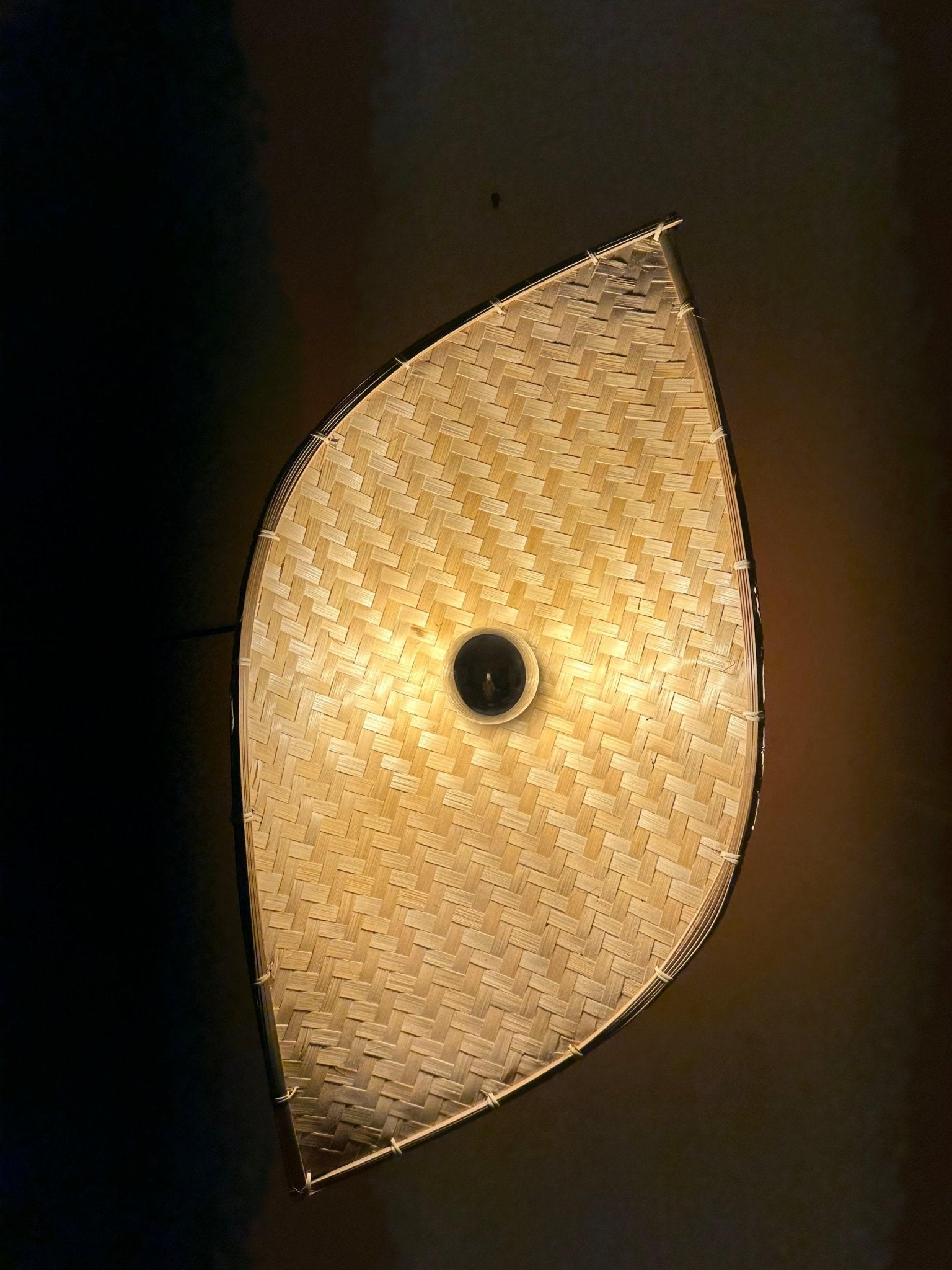 Bamboo curve wall light from below showing inner glow and curved frame – Tesu Lamps & Lighting