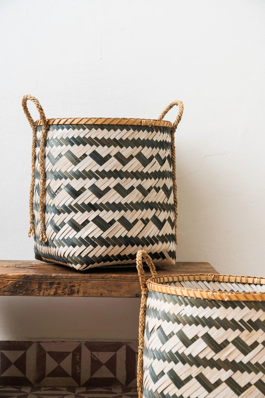 Handcrafted bamboo storage basket with sturdy handle, designed for stylish and eco-friendly organization while adding a natural touch to home décor.