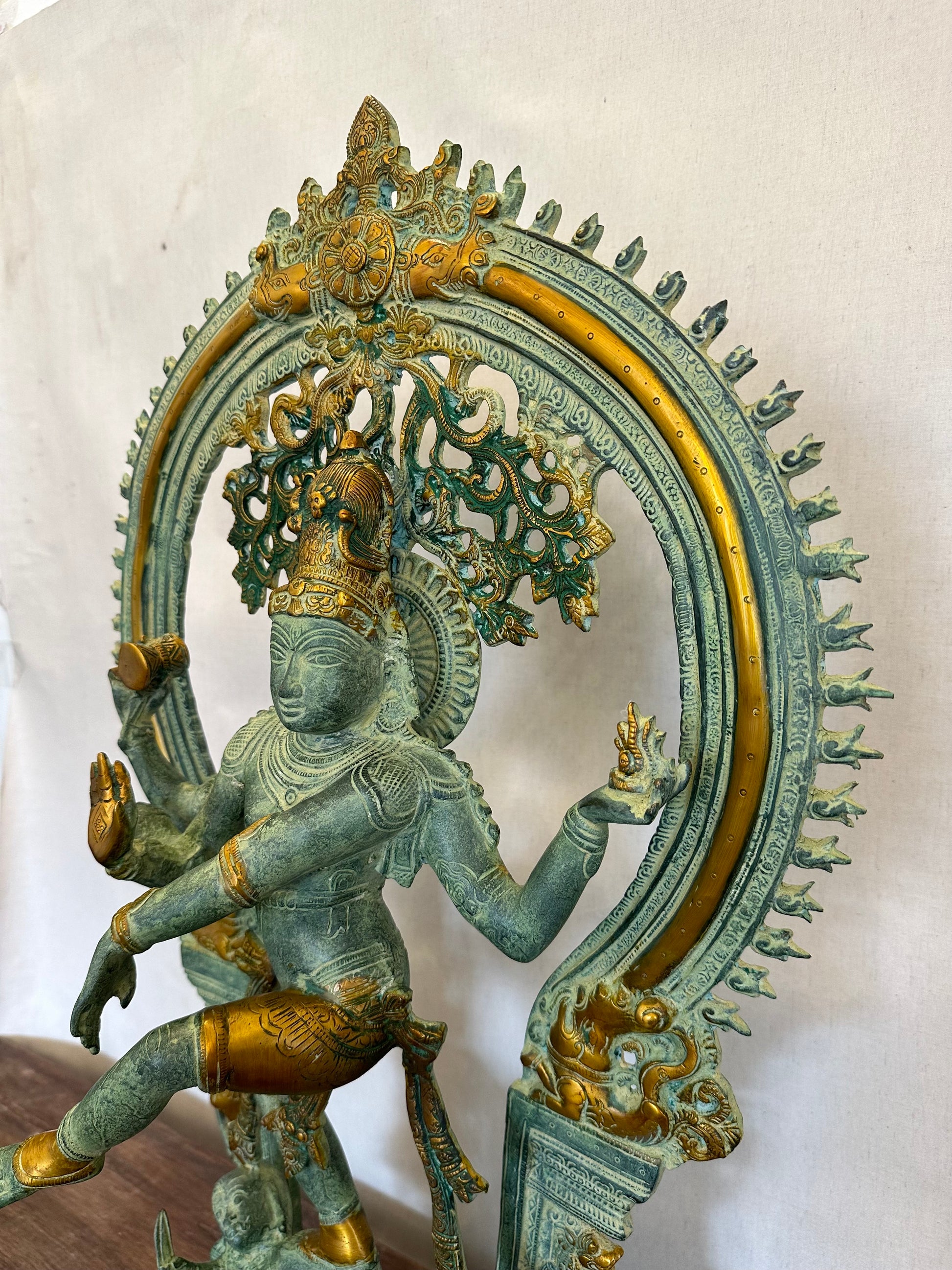 Decorative statue with intricate design on a white background