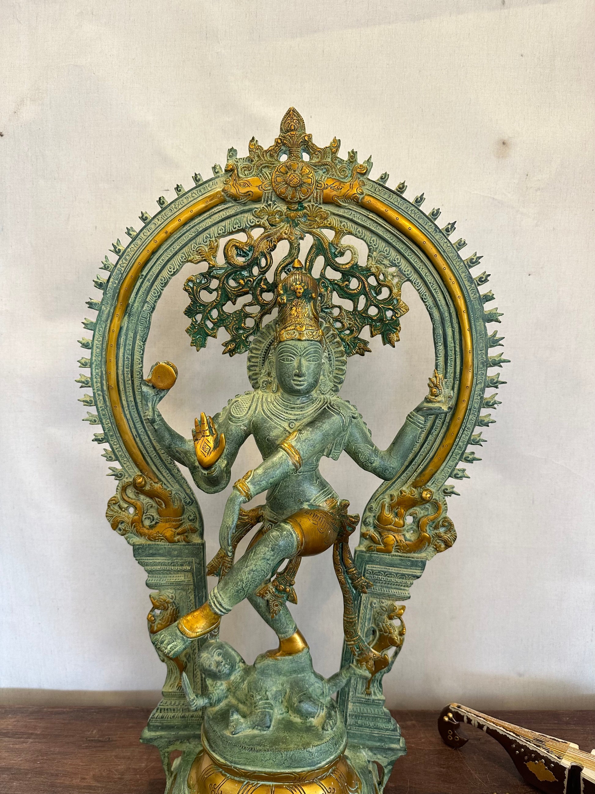 Decorative statue with intricate design on a plain background