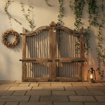 Pair of rustic wooden gates with metal bars 