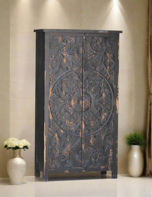 Decorative designed wooden almirah with intricate carvings in room setting – Tesu Furniture & Seating