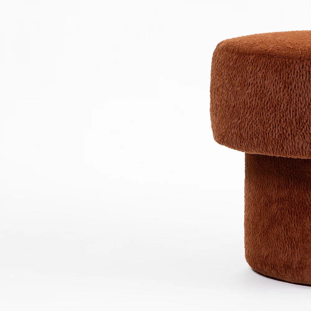 Brown textured ottoman on a white background